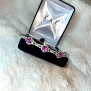 Beautiful silver bracelet with a touch of pink.